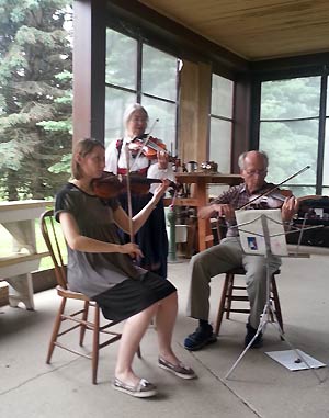 Three fiddlers on porch